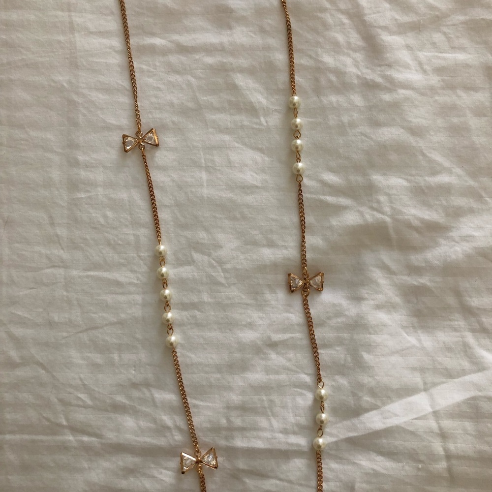 Pearls and bows long gold chain necklace